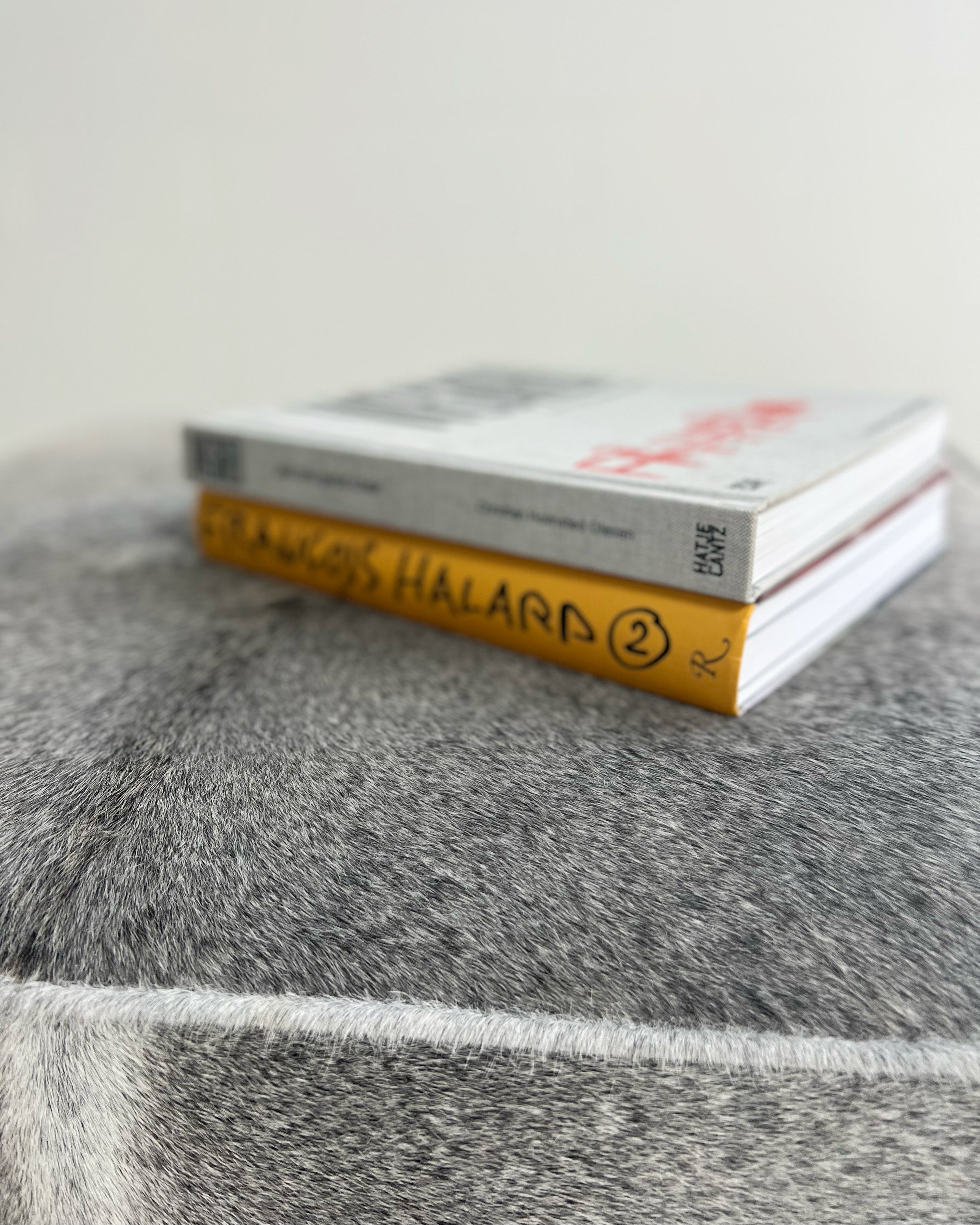 The Forsyth Ottoman in Salt and Pepper Cowhide