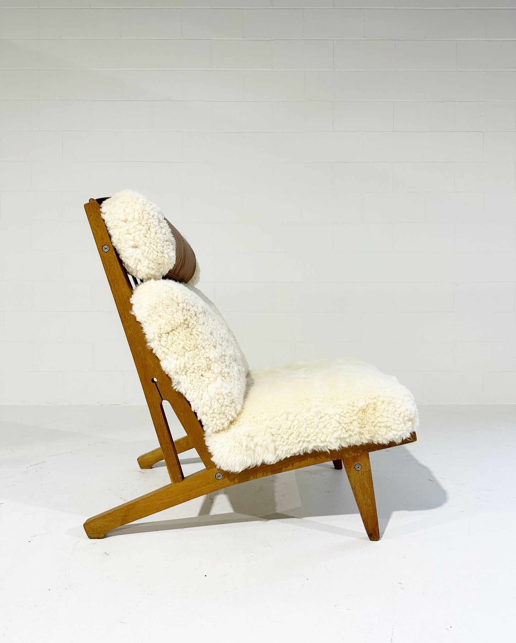Model GE 375 Lounge Chairs in California Sheepskin, One Available