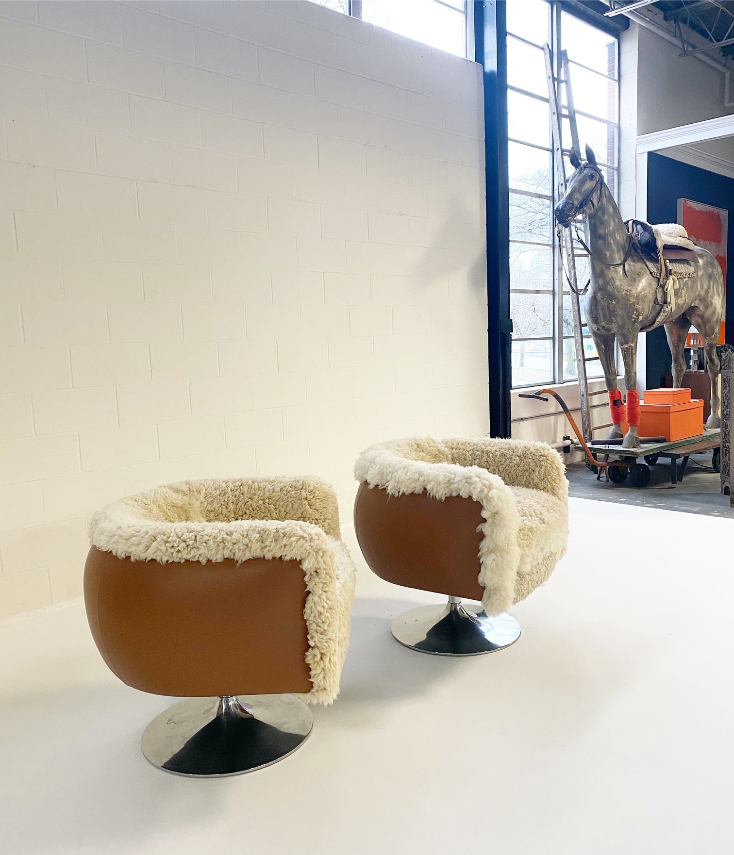 Swivel Lounge Chairs in California Sheepskin and Loro Piana Leather, pair - FORSYTH