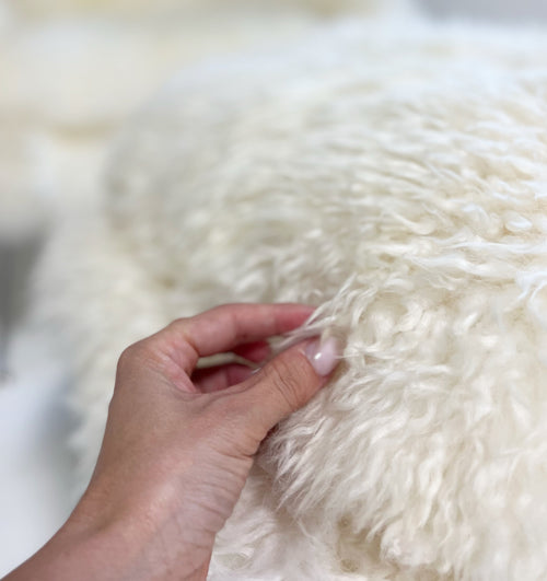 Bespoke Womb Chair and Ottoman in Wavy New Zealand Sheepskin