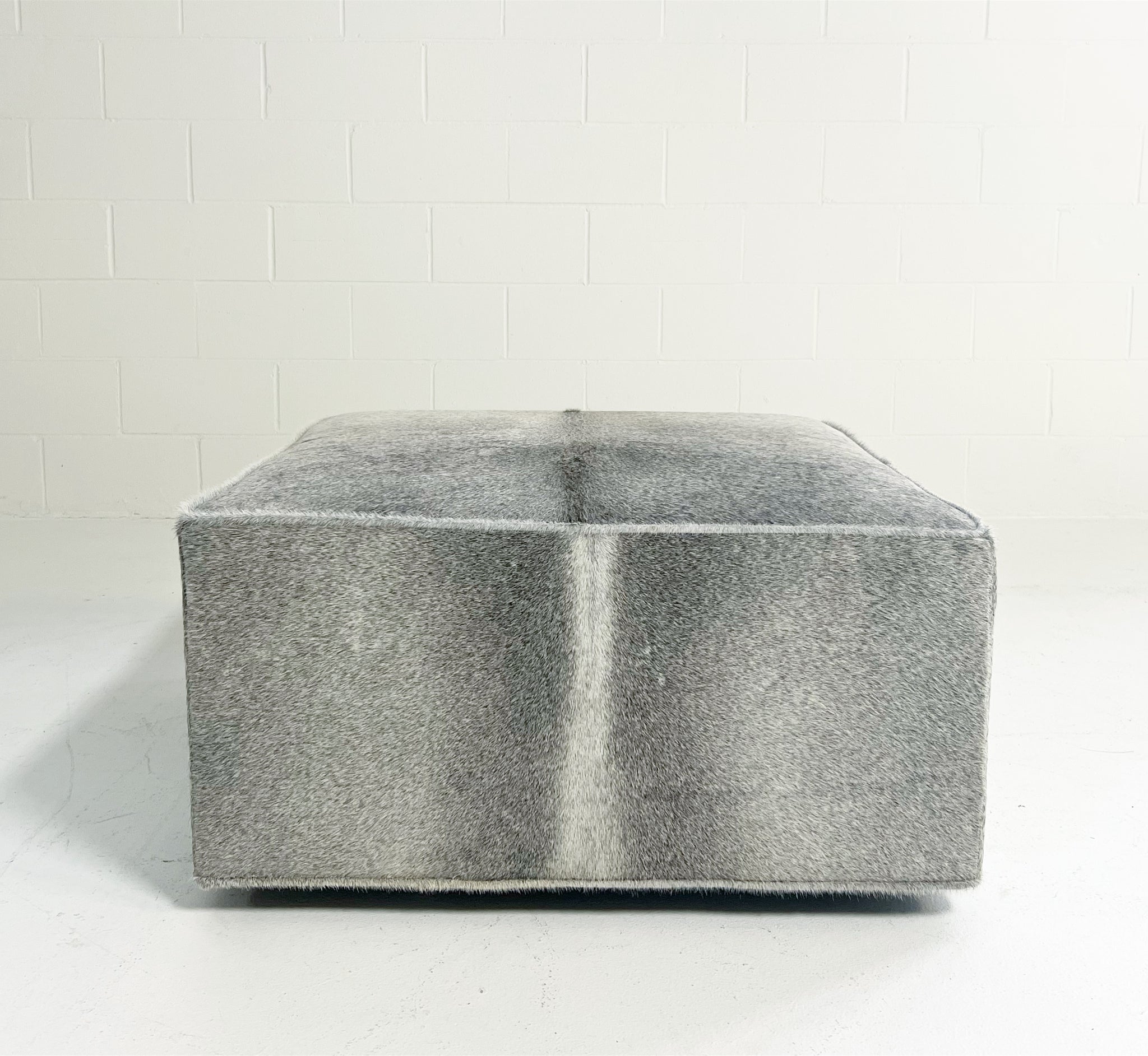The Forsyth Ottoman in Salt and Pepper Cowhide