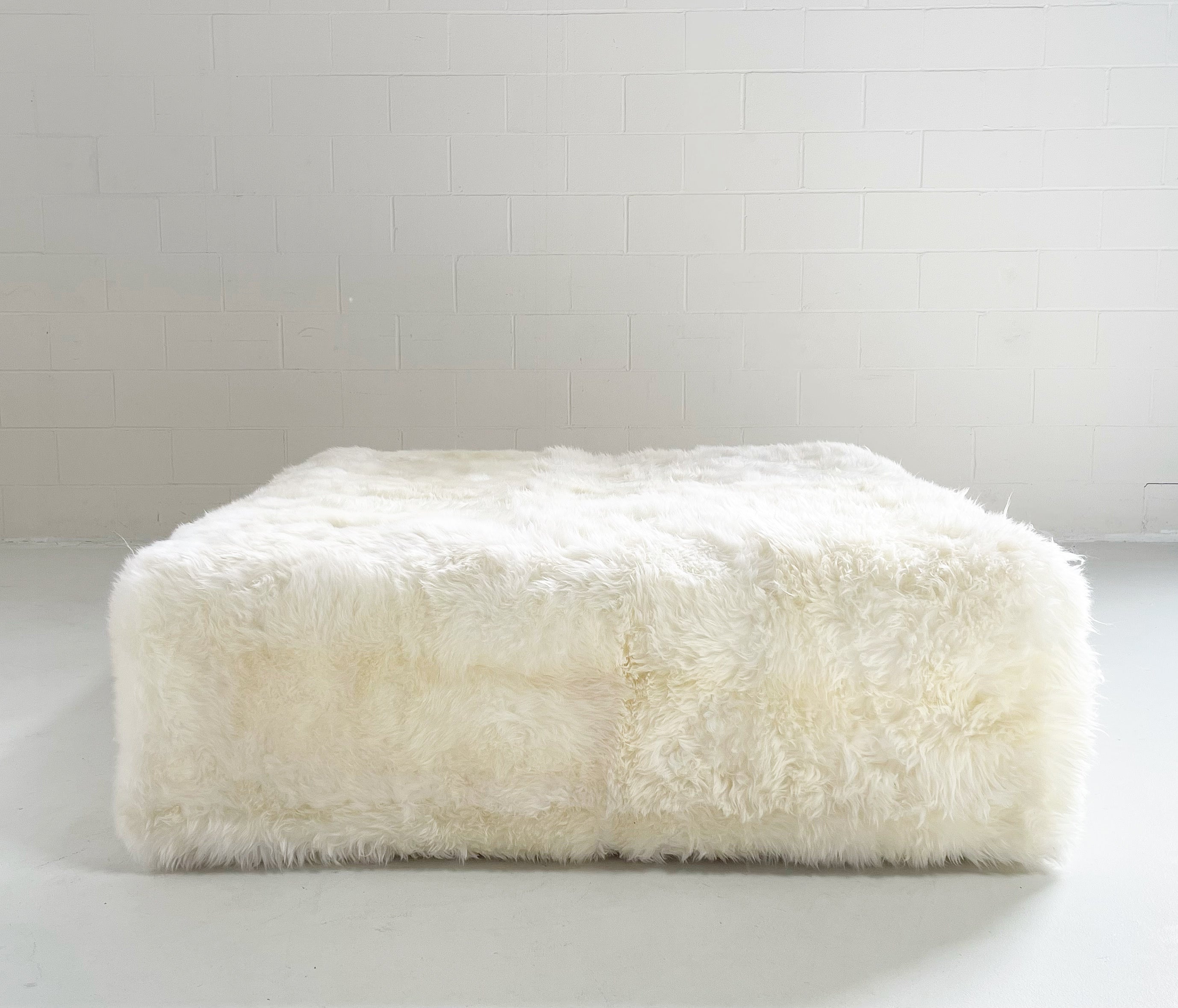 The Forsyth Large Ottoman in Sheepskin, 56 x 56 in