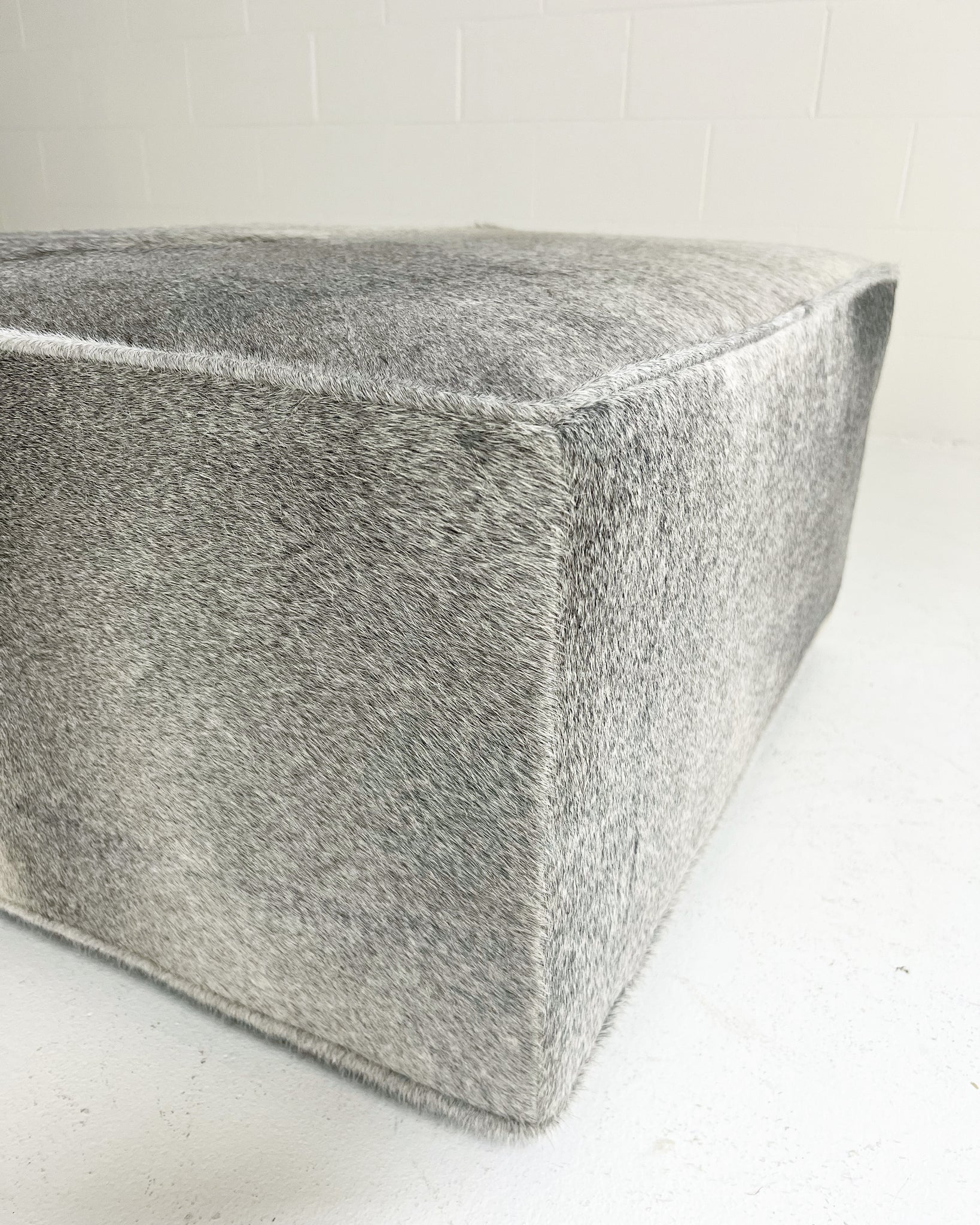 The Forsyth Ottoman in Salt and Pepper Cowhide