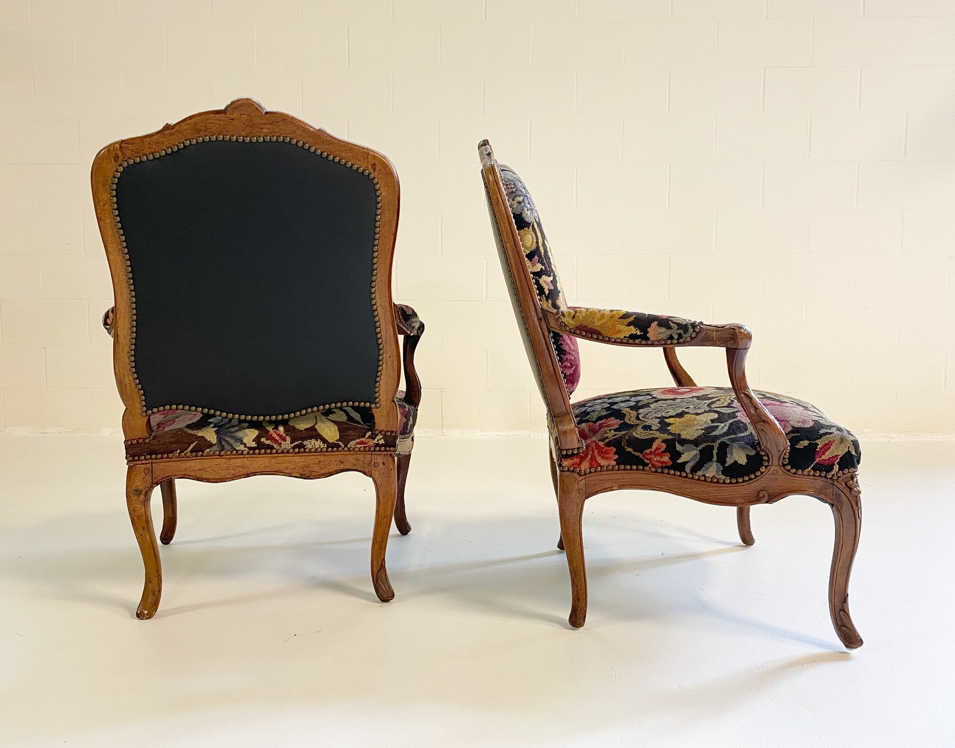 Antique pair of French Louis XV bergère chairs.