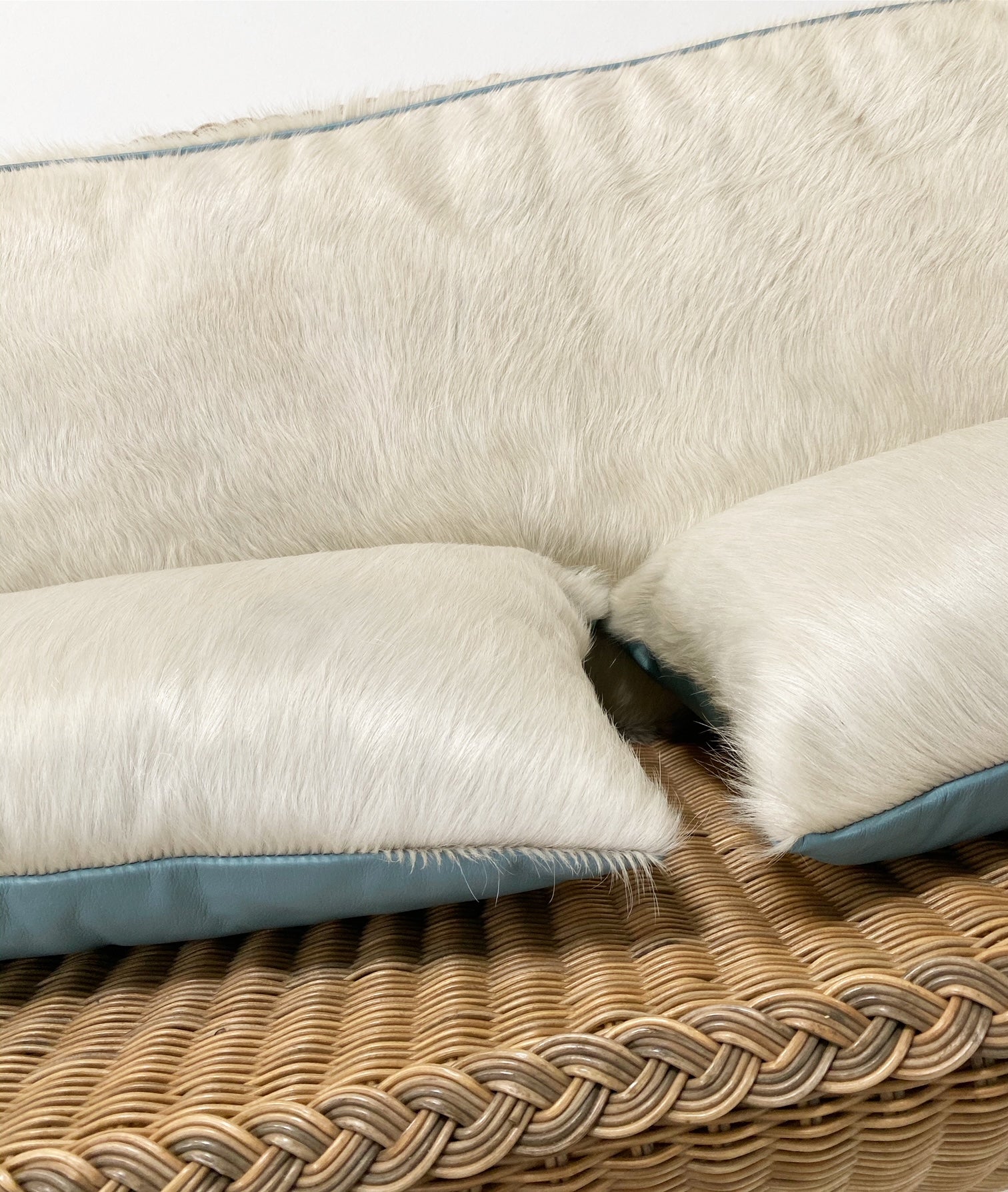 Rattan Loveseat with Custom Brazilian Cowhide and Leather Cushions