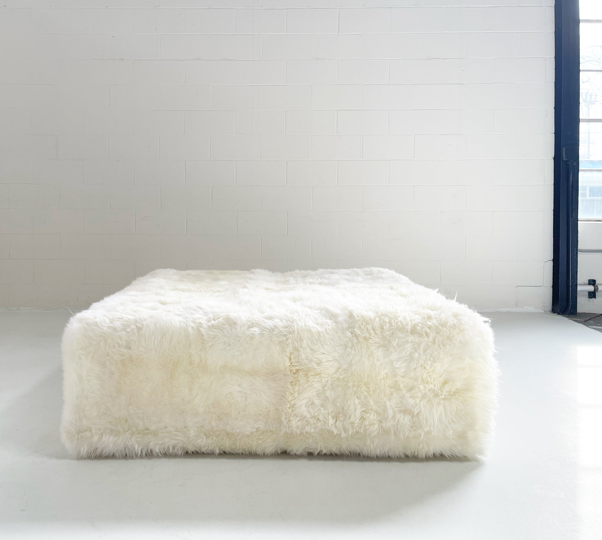 The Forsyth Large Ottoman in Sheepskin, 56 x 56 in