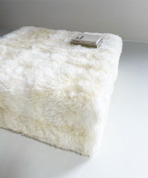 The Forsyth Large Ottoman in Sheepskin, 56 x 56 in