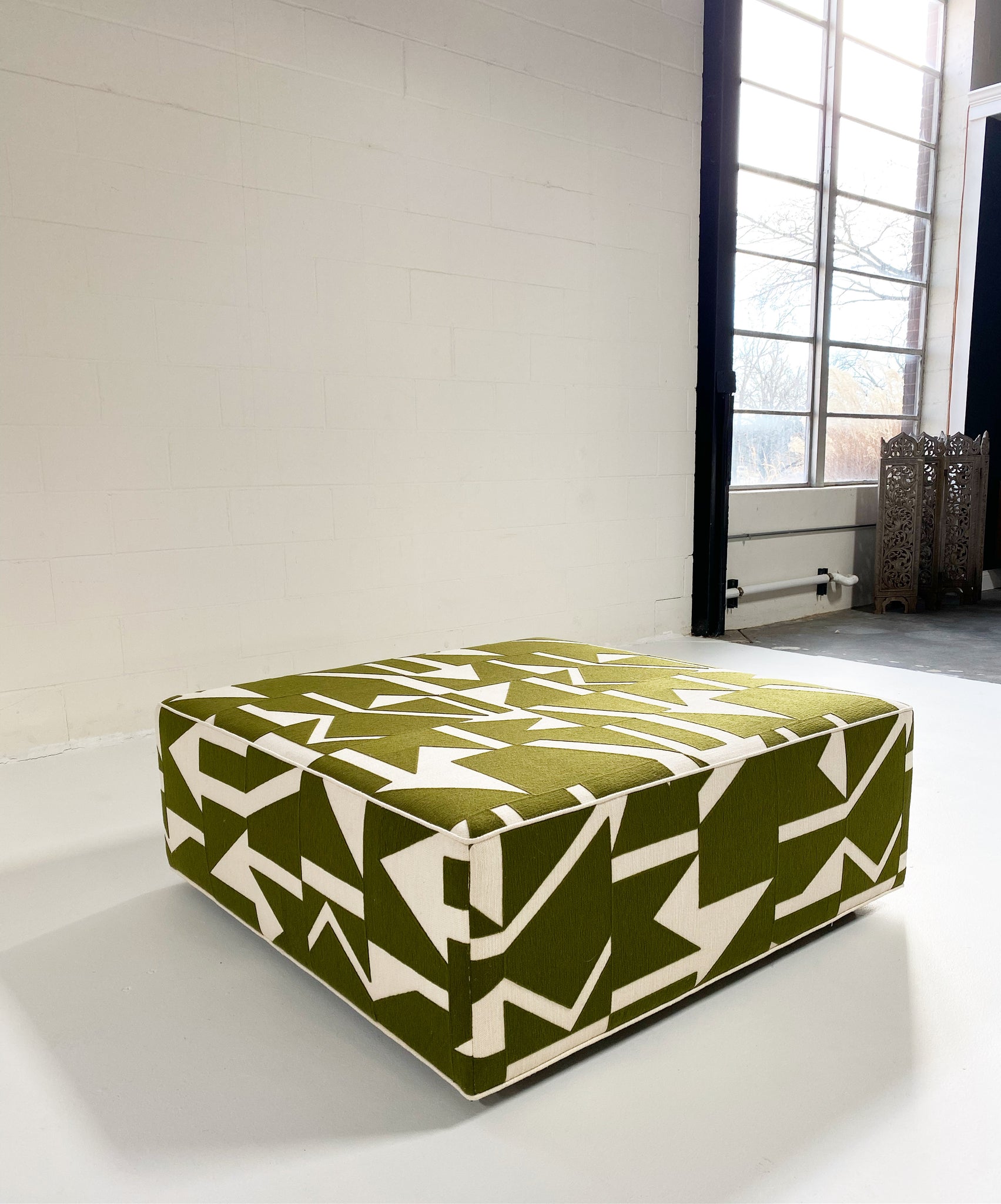 The Forsyth Ottoman in Pierre Frey Wokabi Fabric