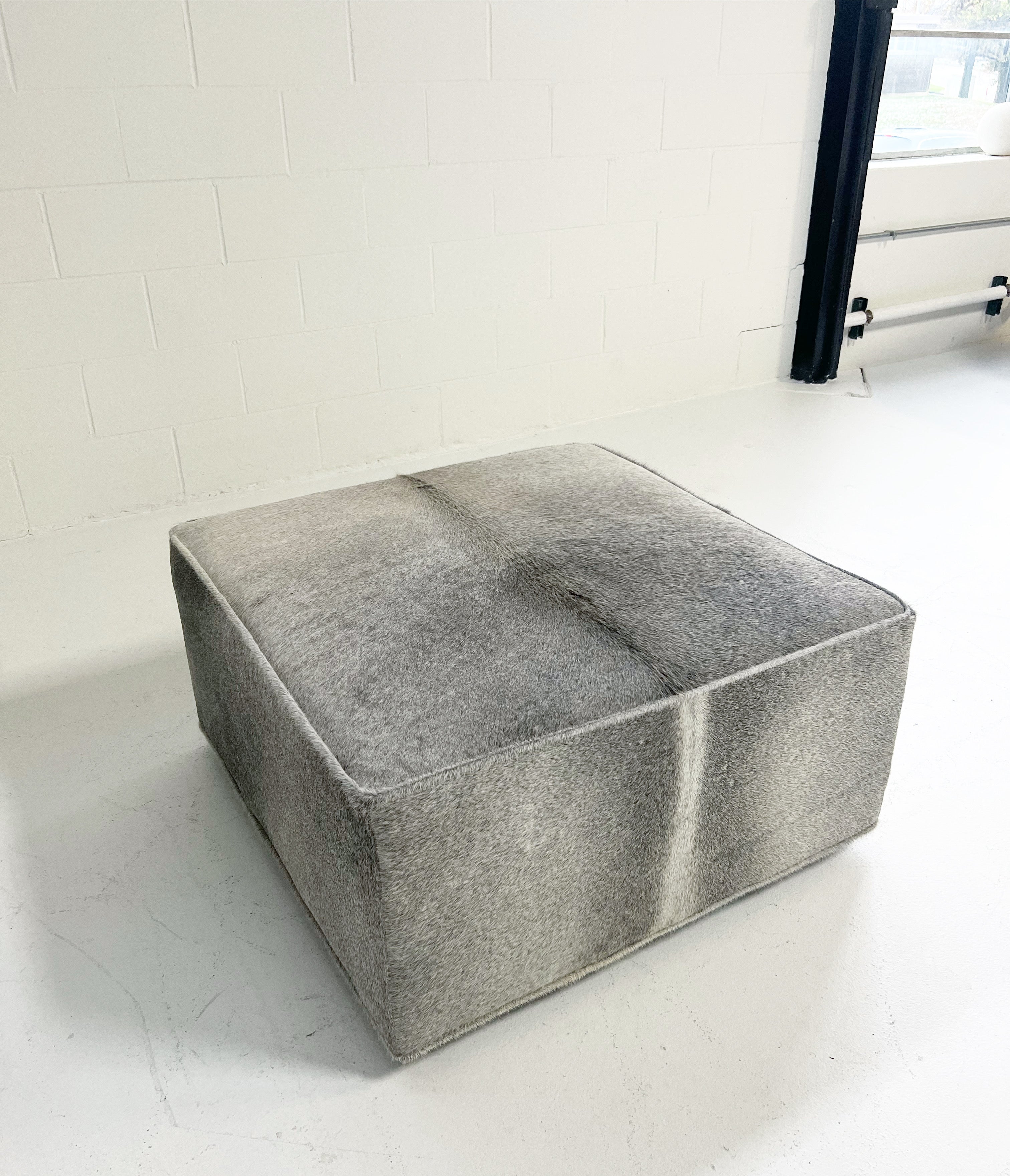 The Forsyth Ottoman in Salt and Pepper Cowhide