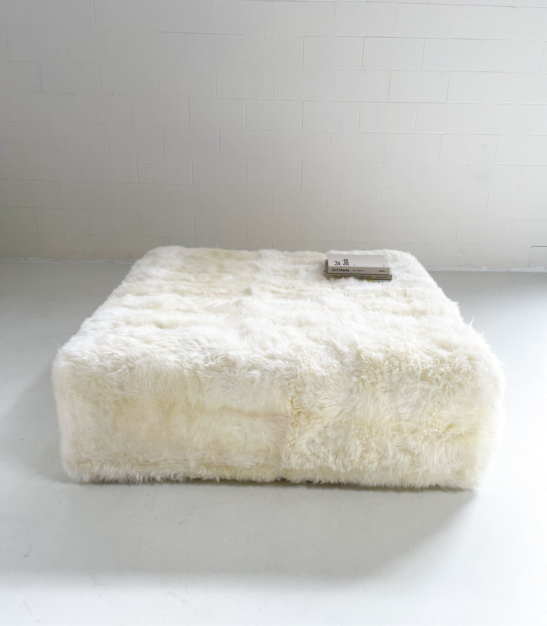 The Forsyth Large Ottoman in Sheepskin, 56 x 56 in