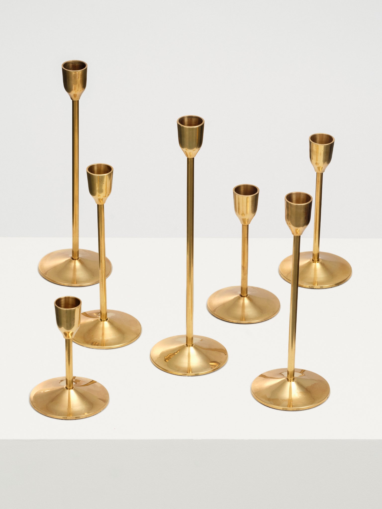 Candlesticks of Various Sizes, Set of 7 - Brass