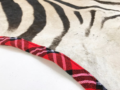 Zebra Hide Rug, Trimmed in Maasai Shuka - FORSYTH