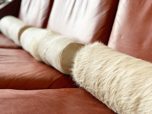 Ivory Cowhide Bolster Pillow, 20" - FORSYTH