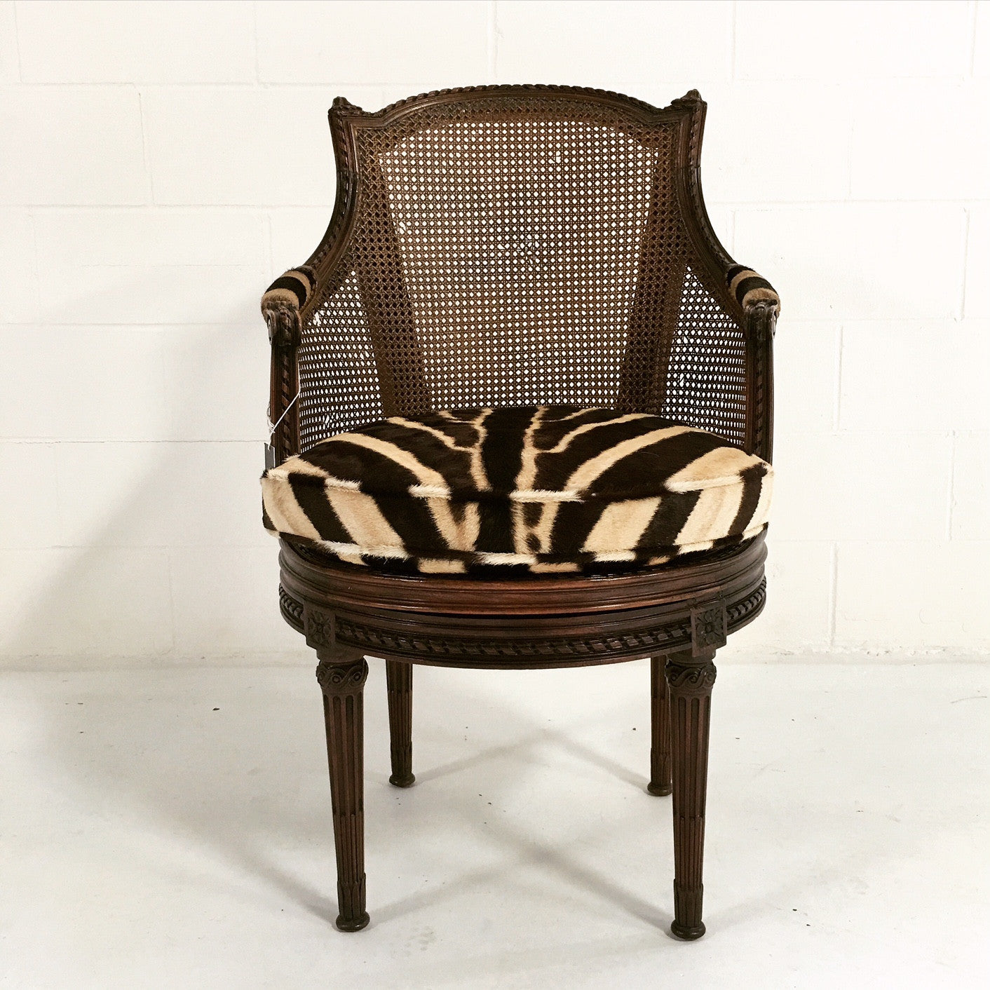 Antique Bergere Swivel Chair in Zebra Hide - FORSYTH