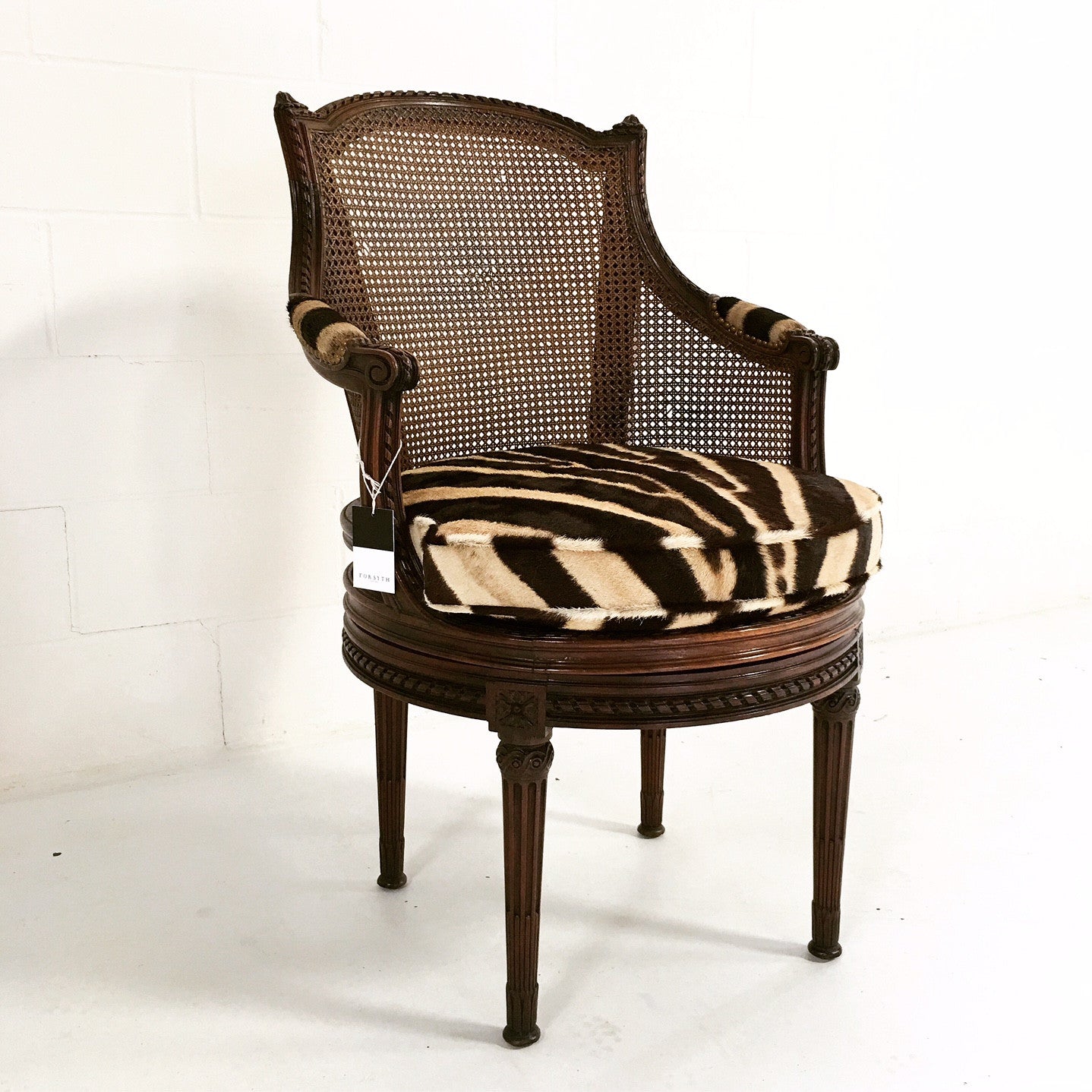 Antique Bergere Swivel Chair in Zebra Hide - FORSYTH