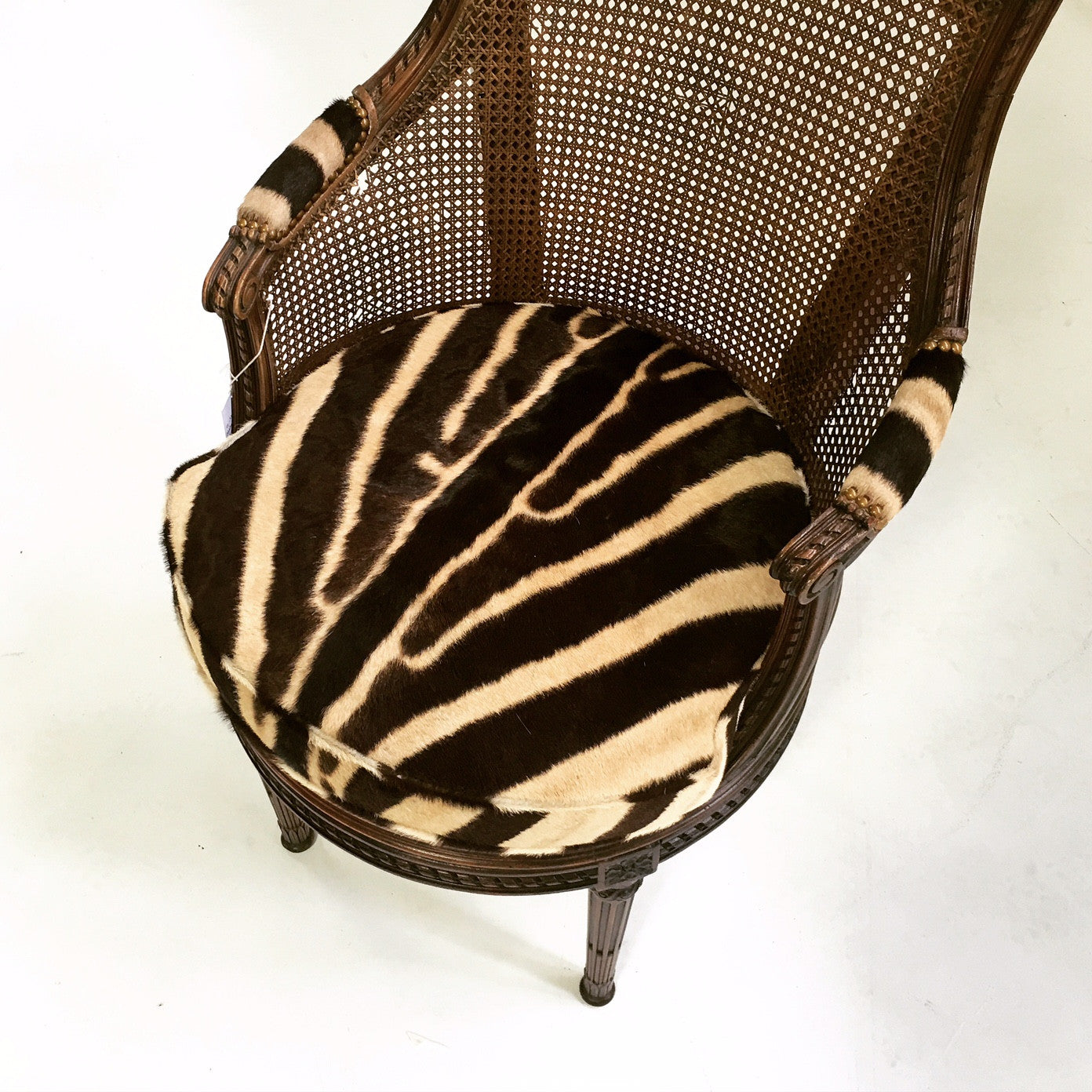 Antique Bergere Swivel Chair in Zebra Hide - FORSYTH