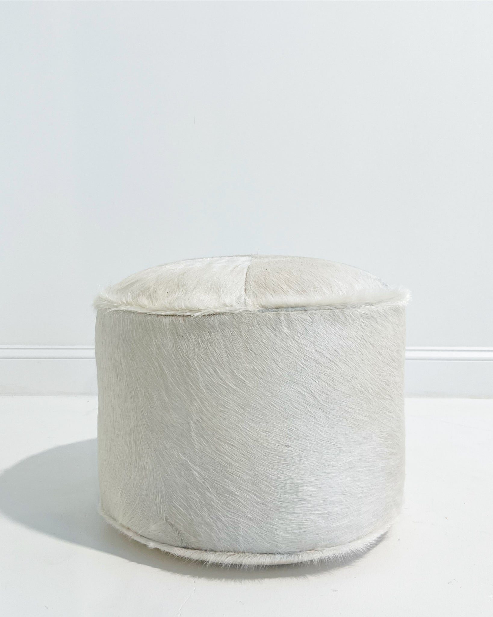 The Forsyth Pouf Ottoman in Ivory Cowhide 01