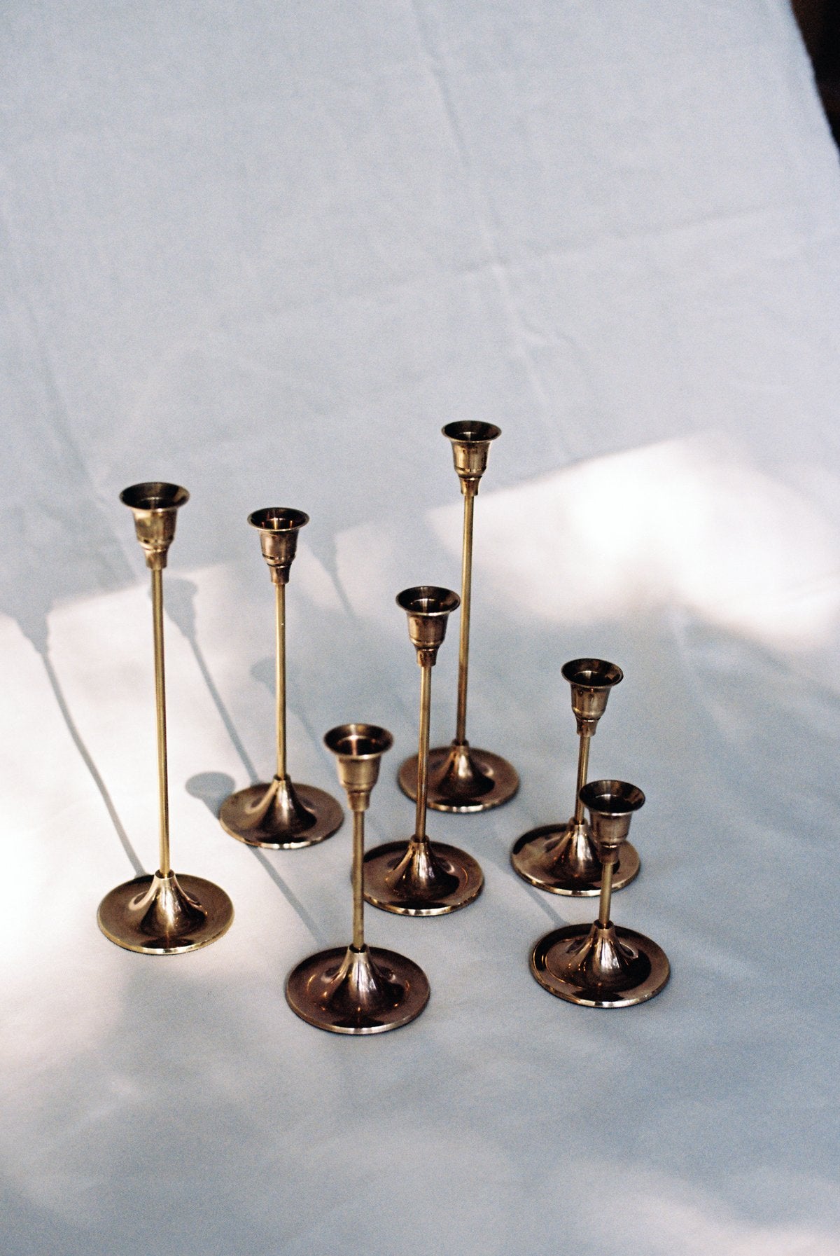 Candlesticks of Various Sizes, Set of 7 - Brass